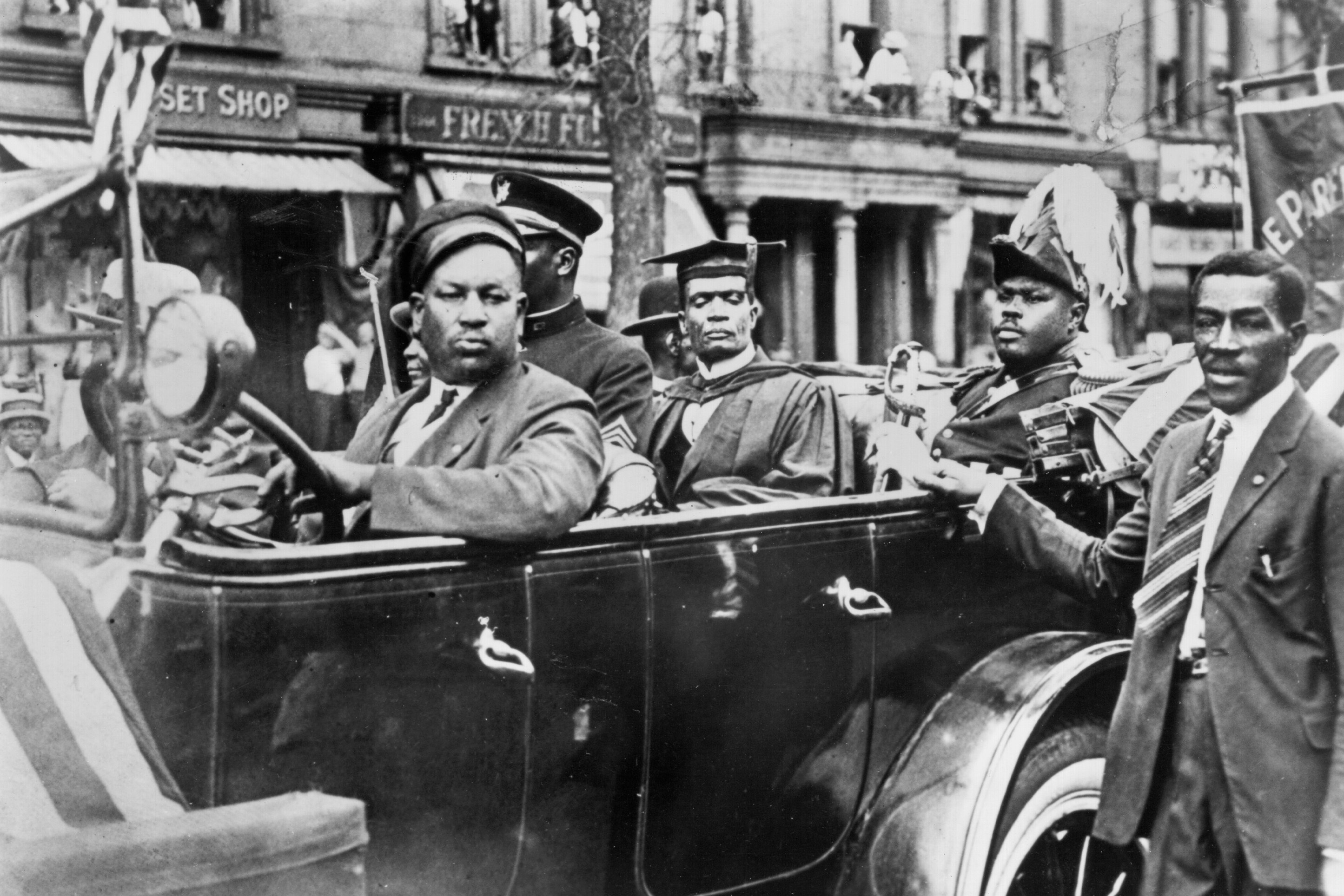 Marcus Mosiah Garvey (in back of vehicle, in military uniform) during a Universal Negro Improvement Association (UNIA) parade in Harlem, New York, 1924. Photo by James Van Der Zee via Michael Ochs Archives/Getty Images.
